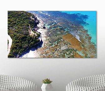 Aerial photograph of the stunning aquamarine crystal clear waters of Point Peron Beach, Rockingham available in a selection of canvas sizes by Delon Govender